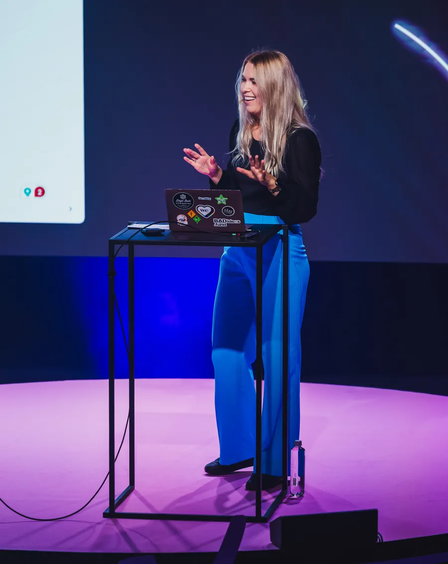 Annika Helendi speaking on stage at the grit. conference